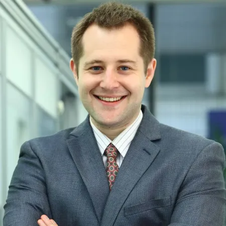 Headshot of Brian Cathcart smiling at the camera