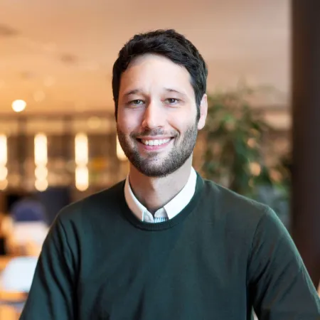 Headshot of Jake Pratley smiling at the camera